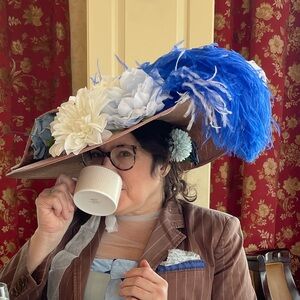 Elegant Brown Hat with Blue and White Feathers